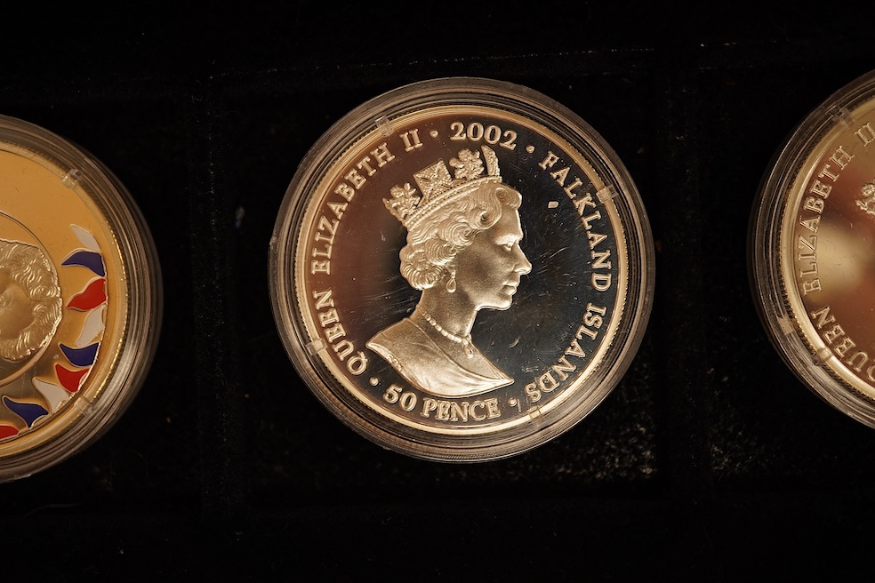 Yorkshire Mint 'Royal Arms Collection' of 12 enamelled silver armorial shields, cased and Westminster Mint 12 QEII Falkland Islands Golden Jubilee proof silver coins, cased (2 cases)